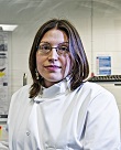 Elizabeth smiling in lab coat